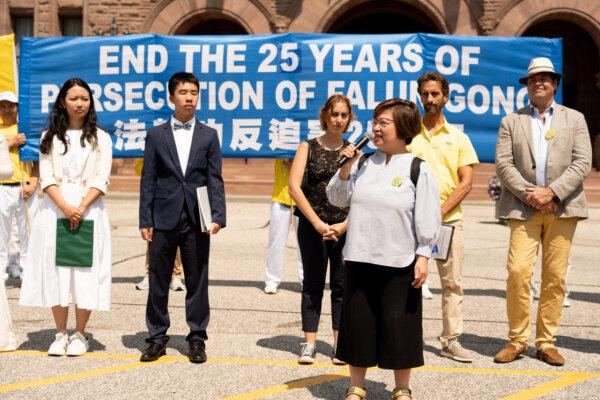 Gloria Fung, president of Canada-Hong Kong Link, speaks to the crowd attending an event at Queen's Park in Toronto, Ont., on July 20, 2024. The event commemorates the 25th anniversary of the Chinese regime's persecution of Falun Gong. (Evan Ning/ The Epoch Times)