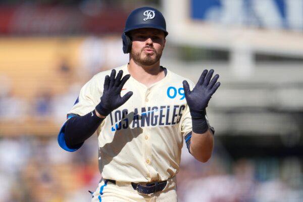 Los Angeles Dodgers' Gavin Lux celebrates as he rounds the bases following his solo home run during the second inning of a baseball game against the Boston Red Sox in Los Angeles on July 20, 2024. (Marcio Jose Sanchez/AP Photo)