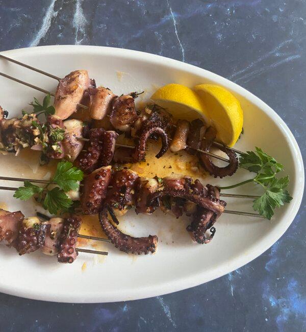 Wild-caught whole octopus is simmered for tenderness and then grilled until lightly charred. (JeanMarie Brownson/TNS)