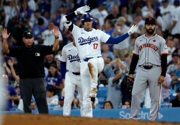 Designated hitter Shohei Ohtani (17) of the Los Angeles Dodgers celebrates at first base after hitting a one run base hit against relief pitcher Randy Rodríguez (73) of the San Francisco Giants during the eight inning in Los Angeles on July 23, 2024. (Kevork Djansezian/Getty Images)