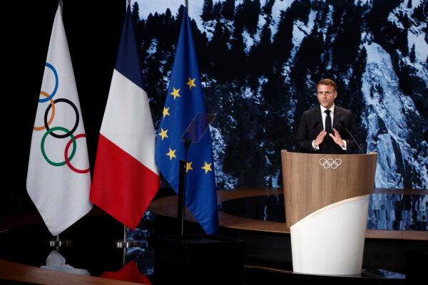 French President Emmanuel Macron makes a speech during the IOC Session meeting ahead of the Paris 2024 Olympic Games in Various Cities, France, on July 24, 2024. (Benoit Tessier/Reuters)