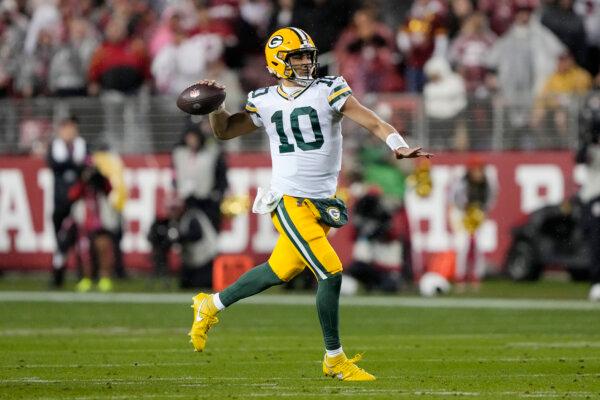 Jordan Love of the Green Bay Packers looks to pass during the first half against the San Francisco 49ers at Levi's Stadium in Santa Clara, California., on January 20, 2024. (Thearon W. Henderson/Getty Images)