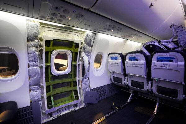 A door plug area of an Alaska Airlines Boeing 737 Max 9 aircraft awaiting inspection is pictured with paneling removed at the airline's facilities at Seattle-Tacoma International Airport in SeaTac, Wash., on Jan. 10, 2024. (Lindsey Wasson/AP Photo)