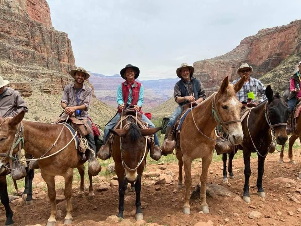 Mr. Tisdale (second from R) rides a mule in the Grand Canyon. (Courtesy of Mike Tisdale)