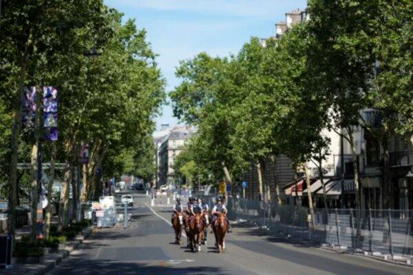 Mounted police officers patrol inside the security perimeter set up for the Olympic Games in Paris, on July 18, 2024, in Paris. (David Goldman/AP Photo)