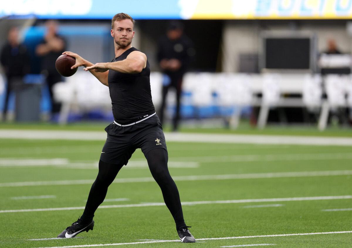 Jake Haener #14 of the New Orleans Saints warms up prior to the preseason game against the Los Angeles Chargers at SoFi Stadium in Inglewood, Calif., on Aug. 20, 2023. (Katelyn Mulcahy/Getty Images)