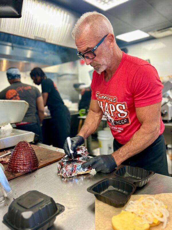 Bob Creager, owner of Chaps, assembles orders in the kitchen. (Courtesy of Chaps Pit Beef)