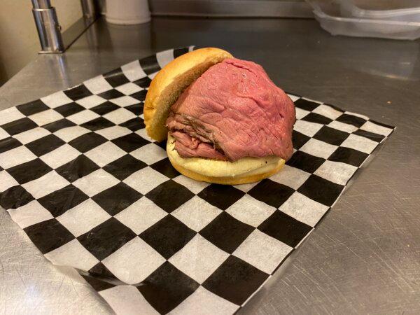 The six-ounce pit beef sandwich at Outlaw, served on a potato roll with Rogers's signature sauces and a sinus-clearing helping of horseradish. (Lynn Topel)
