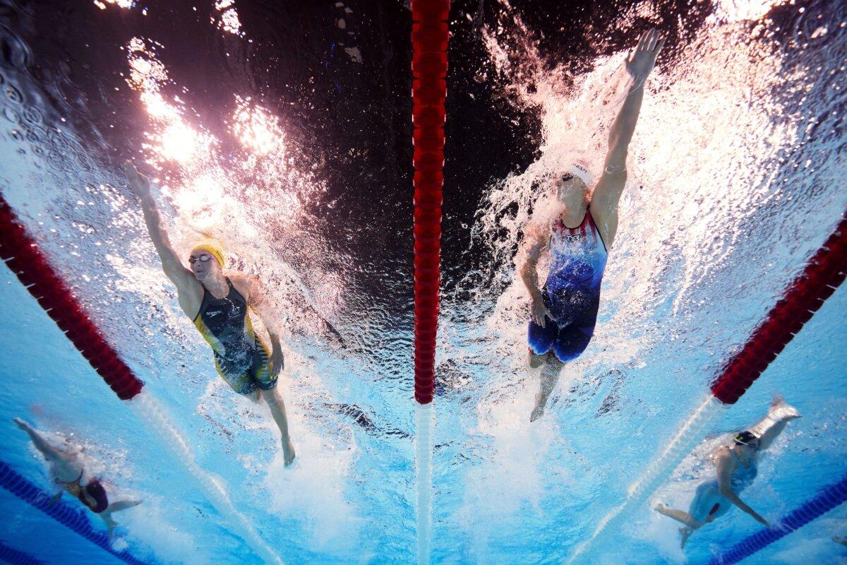 Ariarne Titmus of Team Australia and Katie Ledecky of Team United States compete in the Women's 400m Freestyle Heats on day one of the Olympic Games Paris 2024 at Paris La Defense Arena in Nanterre, France, on July 27, 2024. (Adam Pretty/Getty Images)
