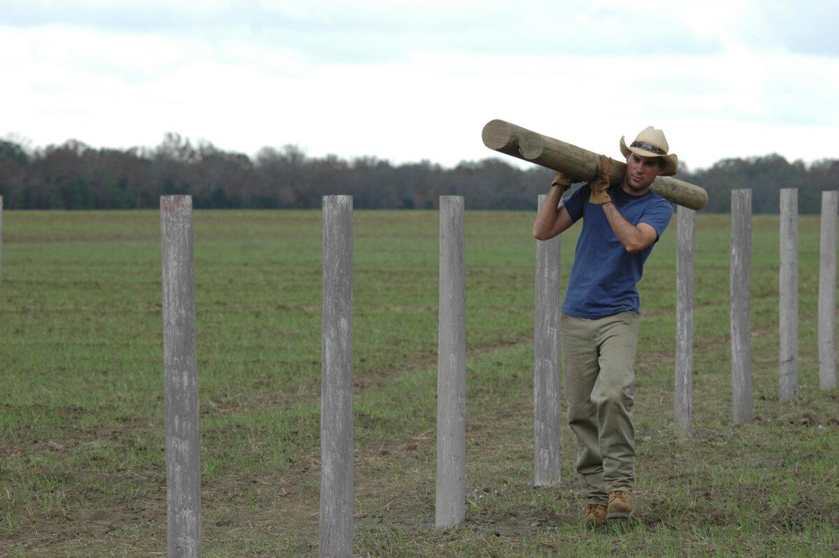 Jason (Drew Fuller) works on Gus Caldwell's ranch erecting fence posts as one of his tasks, in "The Ultimate Gift." (MovieStills DB)