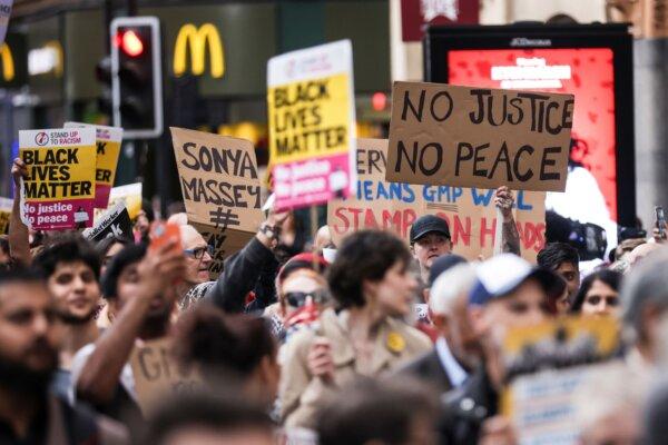 A Stand Up To Racism demonstration in Manchester, England, on July 25, 2024, two days after a video appeared to show a man being kicked as he lay on the floor at Manchester Airport. (James Speakman/PA)