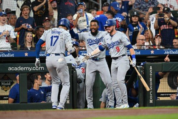 Shohei Ohtani (17) of the Los Angeles Dodgers celebrates his home run with Teoscar Hernandez (37) and Gavin Lux (9) against the Houston Astros during the third inning in Houston on July 27, 2024. (Jack Gorman/Getty Images)