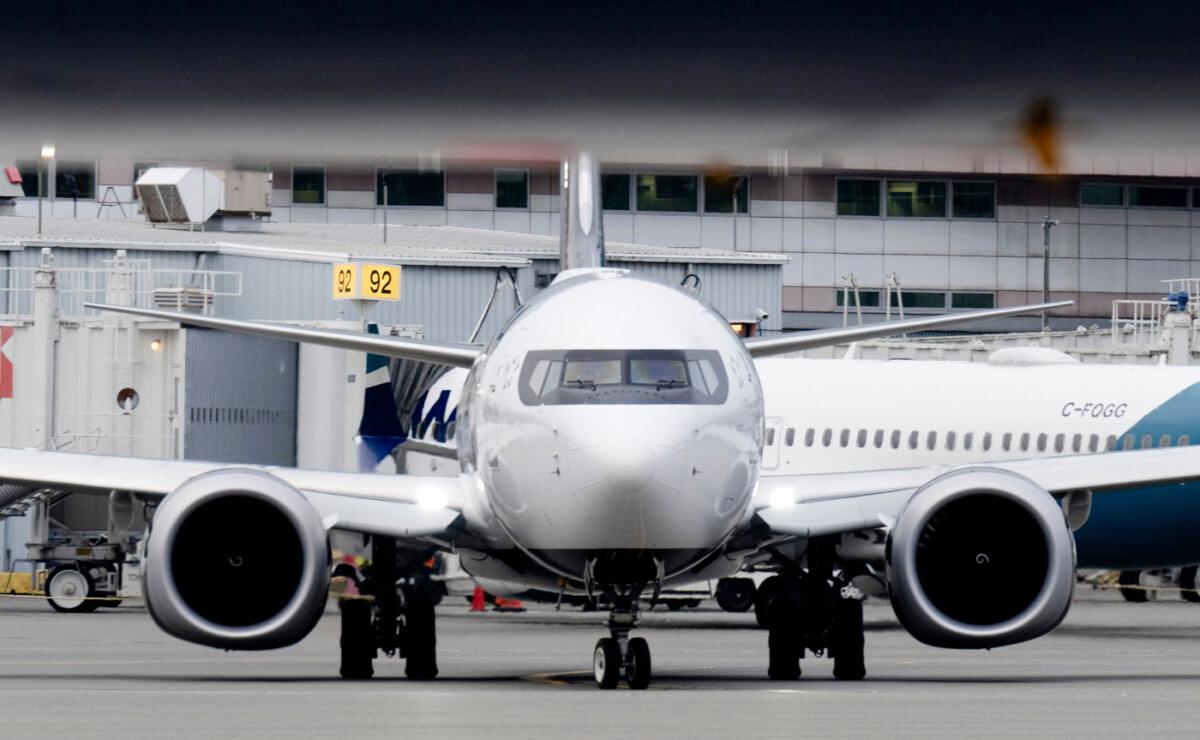 A plane taxis at the Vancouver International Airport in a file photo. (The Canadian Press/Adrian Wyld)