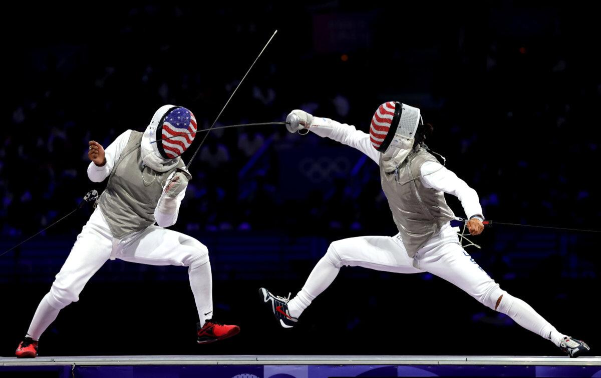 Lauren Scruggs of Team United States (L) competes with Lee Kiefer of Team United States during the Women's Foil Individual Gold Medal Bout between Lauren Scruggs of Team United States and Lee Kiefer of Team United States day two of the Olympic Games Paris 2024 at Grand Palais in Paris on July 28, 2024. (Patrick Smith/Getty Images)