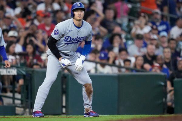 Los Angeles Dodgers designated hitter Shohei Ohtani leads off third base during the ninth inning of a baseball game against the Houston Astros, in Houston on July 28, 2024. (Kevin M. Cox/AP Photo)