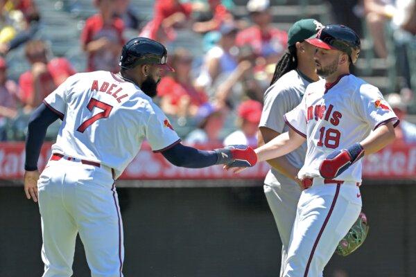 Jo Adell (7) and Nolan Schanuel (18) score on a single by Willie Calhoun (5) of the Los Angeles Angels the third inning against the Oakland Athletics in Anaheim, Calif., on July 28, 2024. (Jayne Kamin-Oncea/Getty Images)
