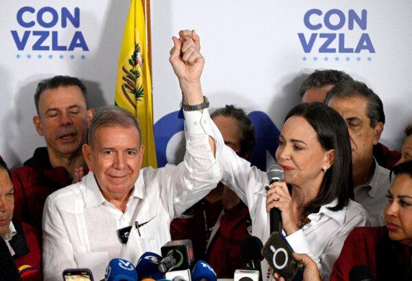 Venezuelan opposition leader María Corina Machado (R) talks to reporters, accompanied by opposition presidential candidate Edmundo González, following release of the presidential election results in Caracas on July 29, 2024. (Federico Parra/AFP via Getty Images)