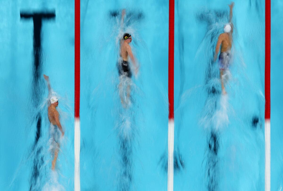 Mykhailo Romanchuk of Team Ukraine, Sven Schwarz of Team Germany and Bobby Finke of Team United States compete in the Men’s 800m Freestyle Heats on day three of the Olympic Games Paris 2024 at Paris La Defense Arena in Nanterre, France, on July 29, 2024. (Richard Heathcote/Getty Images)