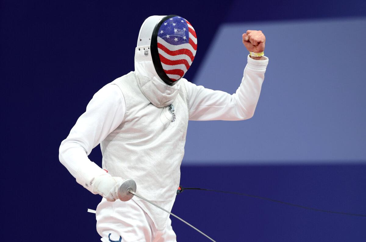 Nick Itkin of Team United States celebrates a point against Alex Tofalides of Team Cyprus (not pictured) while competing in the Fencing Men's Foil Individual Table of 32 on day three of the Olympic Games Paris 2024 at Grand Palais in Paris on July 29, 2024. (Al Bello/Getty Images)