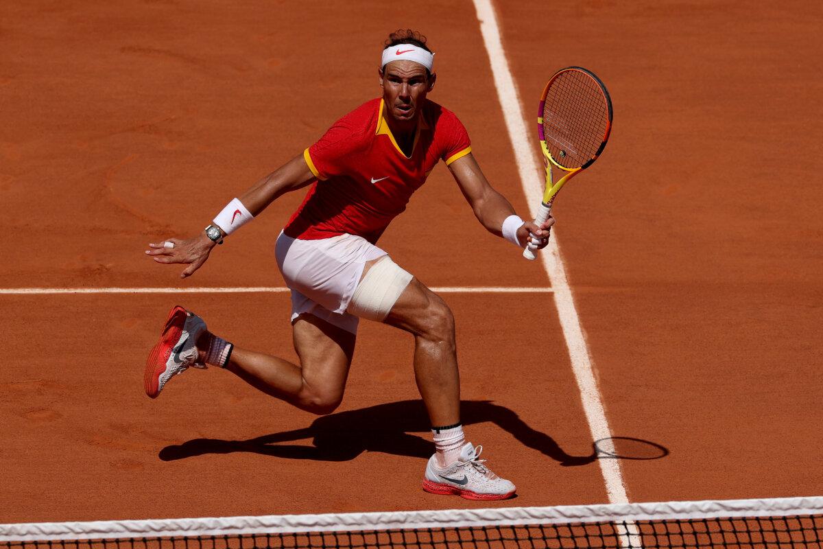 Rafael Nadal of Team Spain plays a forehand against Novak Djokovic of Team Serbia during the Men's Singles second round match on day three of the Olympic Games Paris 2024 at Roland Garros in Paris on July 29, 2024. (Matthew Stockman/Getty Images)