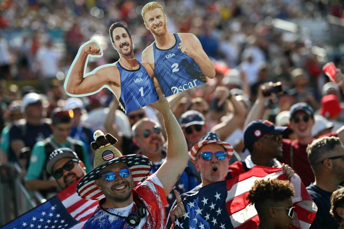 Team USA's fans cheer for their country in the men's pool F beach volleyball match between France and USA during the Paris 2024 Olympic Games at the Eiffel Tower Stadium in Paris on July 29, 2024. (Mauro Pimentel / AFP via Getty Images)