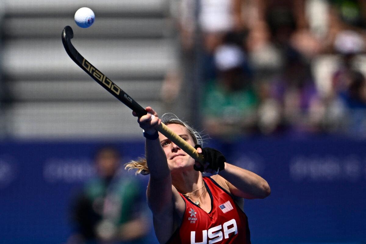 Team USA's forward #17 Elizabeth Yeager controls the ball in the women's pool B field hockey match between Spain and the USA during the Paris 2024 Olympic Games at the Yves-du-Manoir Stadium in Colombes on July 29, 2024. (Julien De Rosa/ AFP via Getty Images)