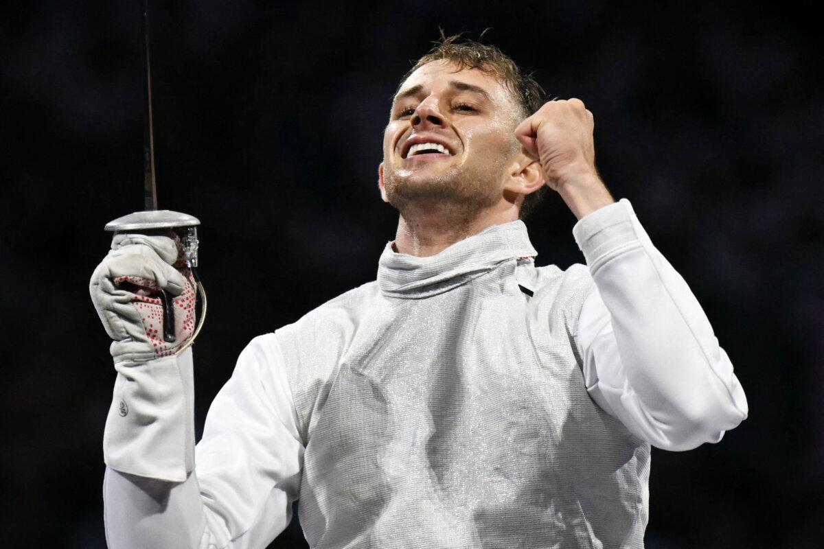 US' Nick Itkin celebrates after winning against Japan's Kazuki Iimura in the men's foil individual bronze medal bout during the Paris 2024 Olympic Games at the Grand Palais in Paris, on July 29, 2024. (Fabrice Coffrini/AFP via Getty Images)