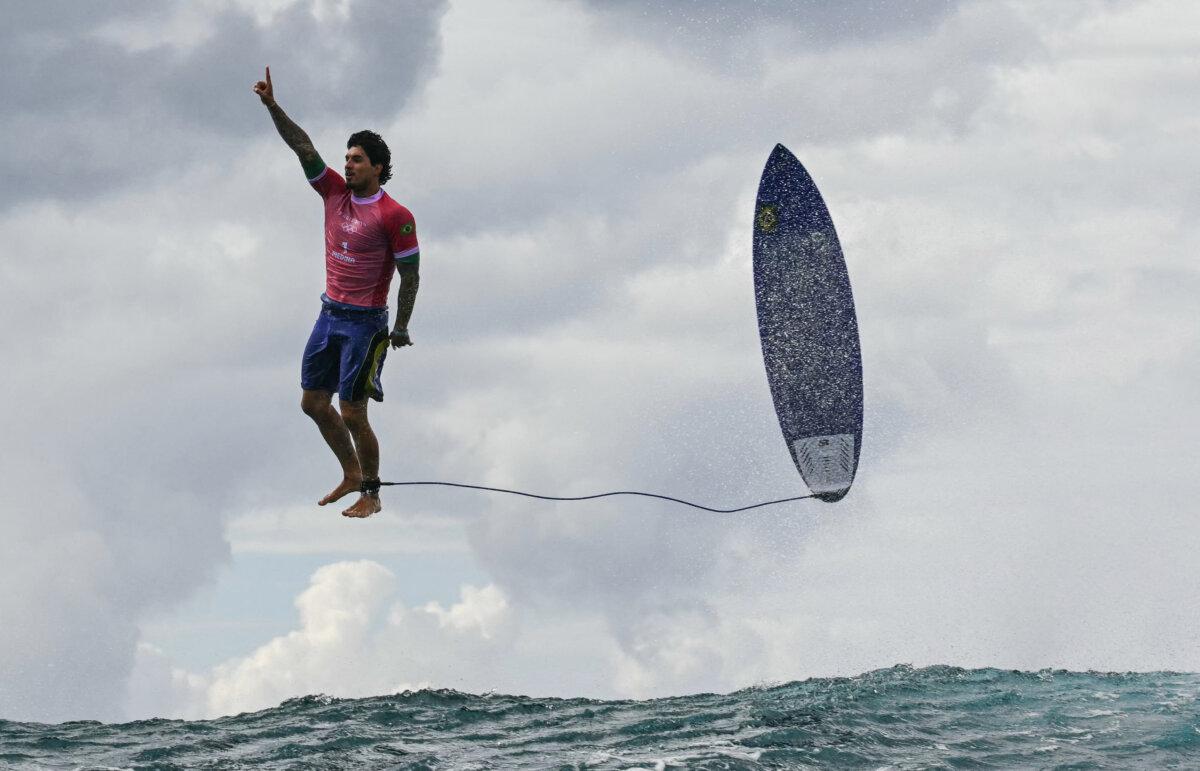 Brazil's Gabriel Medina reacts after getting a large wave in the 5th heat of the men's surfing round 3, during the Paris 2024 Olympic Games, in Teahupo'o, on the French Polynesian Island of Tahiti, on July 29, 2024. (Jerome Brouillet/ AFP via Getty Images)