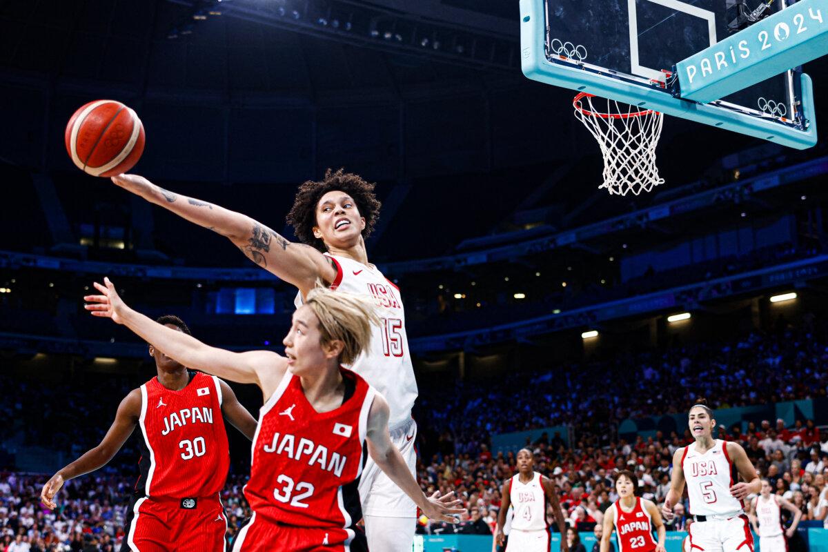 USA's #15 Brittney Griner and Japan's #32 Saori Miyazaki go for a rebound in the women's preliminary round group C basketball match between USA and Japan during the Paris 2024 Olympic Games at the Pierre-Mauroy stadium in Villeneuve-d'Ascq, northern France, on July 29, 2024. (Sameer Al-Doumy / AFP via Getty Images)