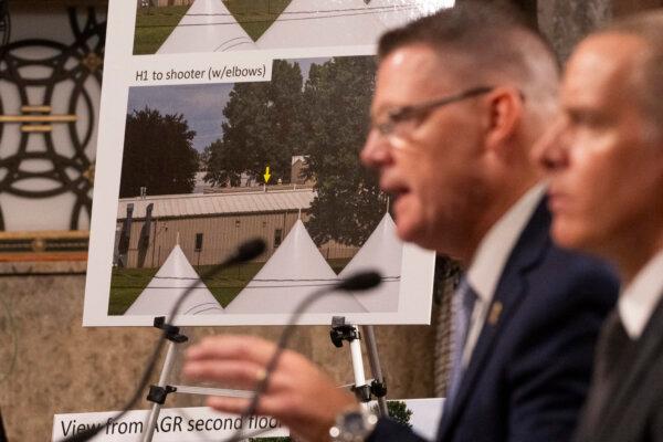 US Secret Service Acting Director Ronald Rowe, Jr. (2nd R), and FBI Deputy Director Paul Abbate (R) show a photo of the shooter's position at the Capitol, on July 30, 2024. (Roberto Schmidt/AFP via Getty Images)