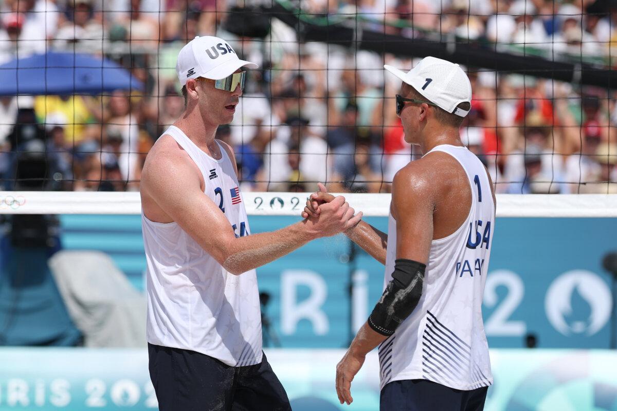 Andrew Benesh and Miles Partain of Team United States celebrate during the Men's Preliminary Phase - Pool D match against Team Morocco on day four of the Olympic Games Paris 2024 at Eiffel Tower Stadium in Paris on July 30, 2024. (Lintao Zhang/Getty Images)