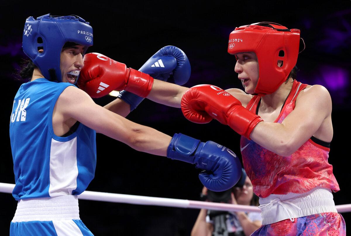 Alyssa Mendoza of Team United States punches Mijgona Samadova of Team Tajikistan during the Women's 57kg preliminary round match between Alyssa Mendoza of Team United States and Mijgona Samadova of Team Tajikistan on day four of the Olympic Games Paris 2024 at North Paris Arena in Paris on July 30, 2024. (Richard Pelham/Getty Images)