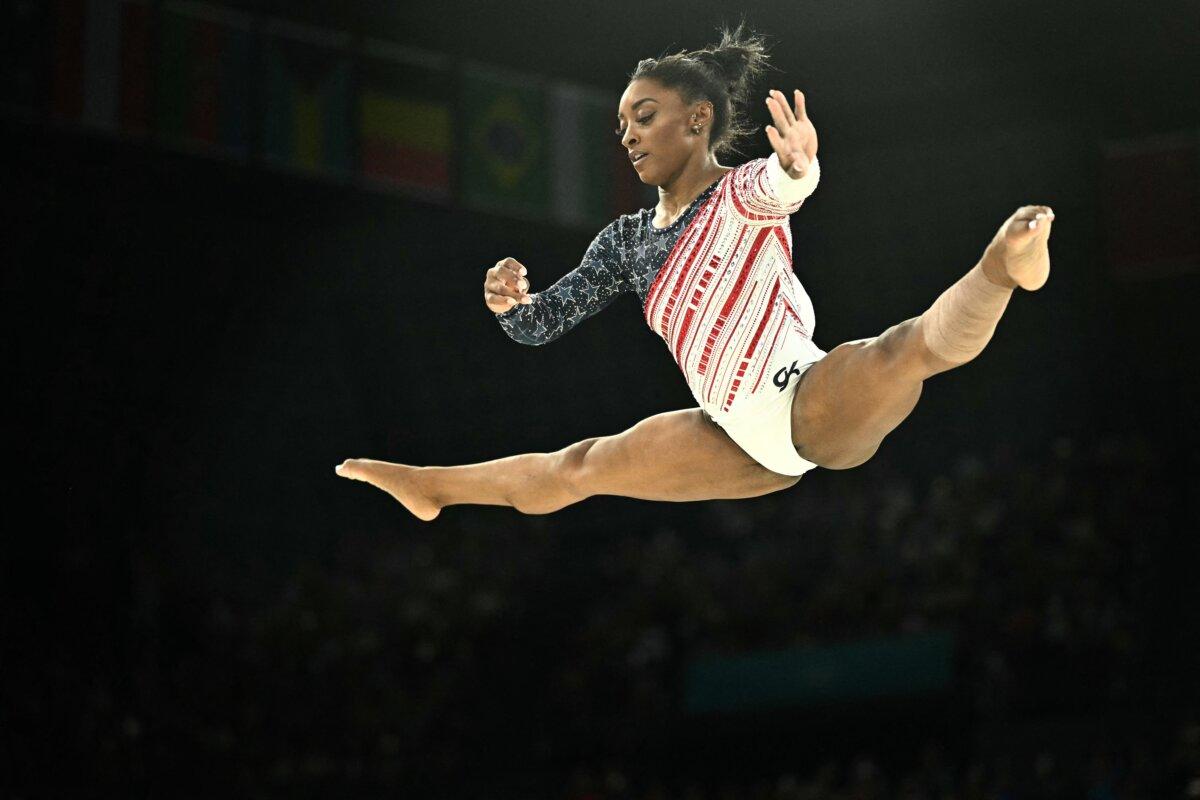 Team USA's Simone Biles competes in the balance beam event of the artistic gymnastics women's team final during the Paris 2024 Olympic Games at the Bercy Arena in Paris, on July 30, 2024. (Lionel Bonaventure/ AFP via Getty Images)