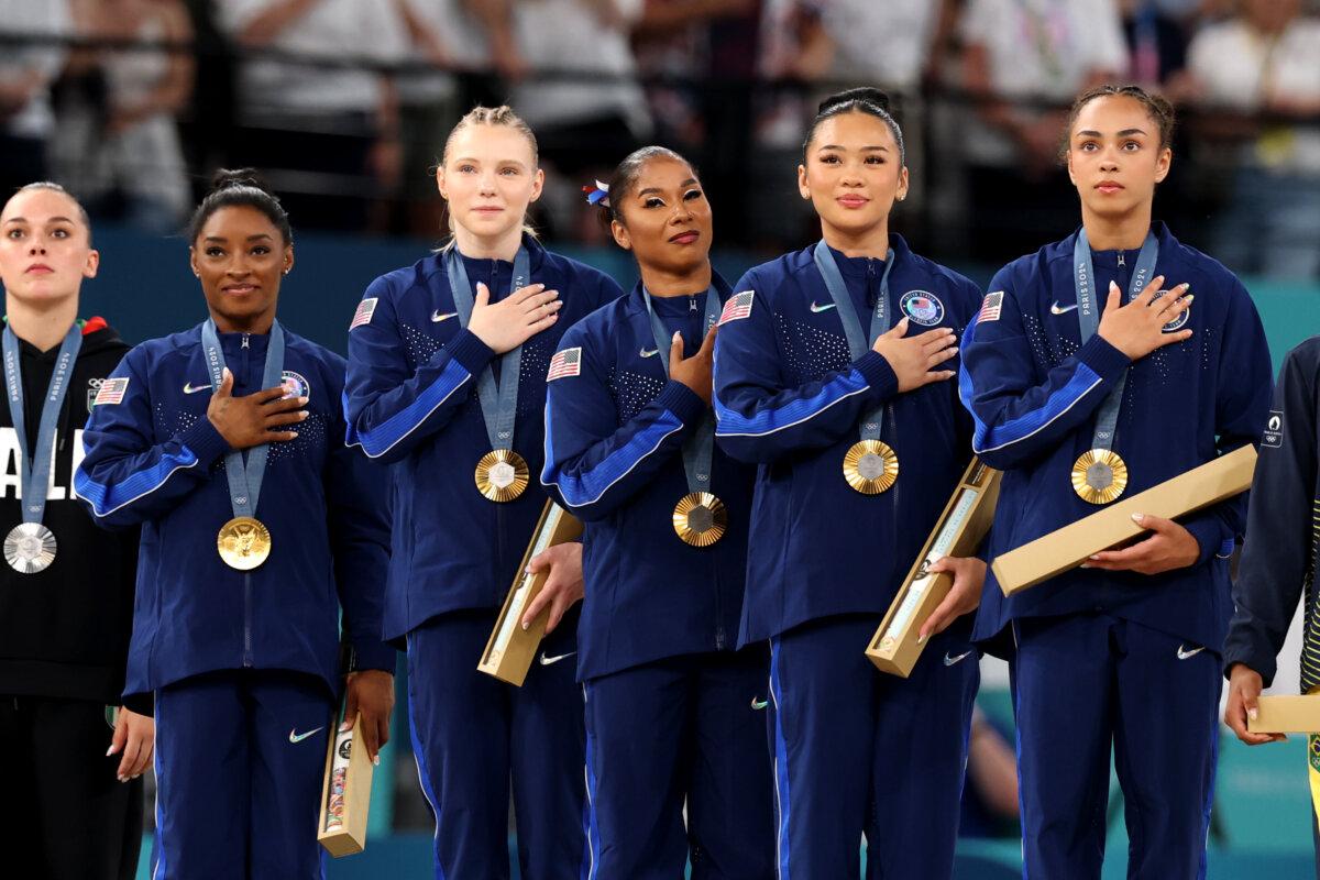 Gold medalists Team United States look on from the podium during the medal ceremony for the Artistic Gymnastics Women's Team Final on day four of the Olympic Games Paris 2024 at Bercy Arena in Paris on July 30, 2024. (Jamie Squire/Getty Images)