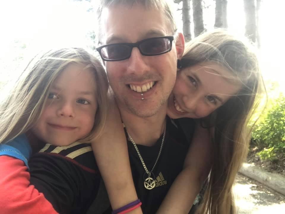 Aaron (L) with his father, Adam Gill, and sister Julianna. (SWNS)