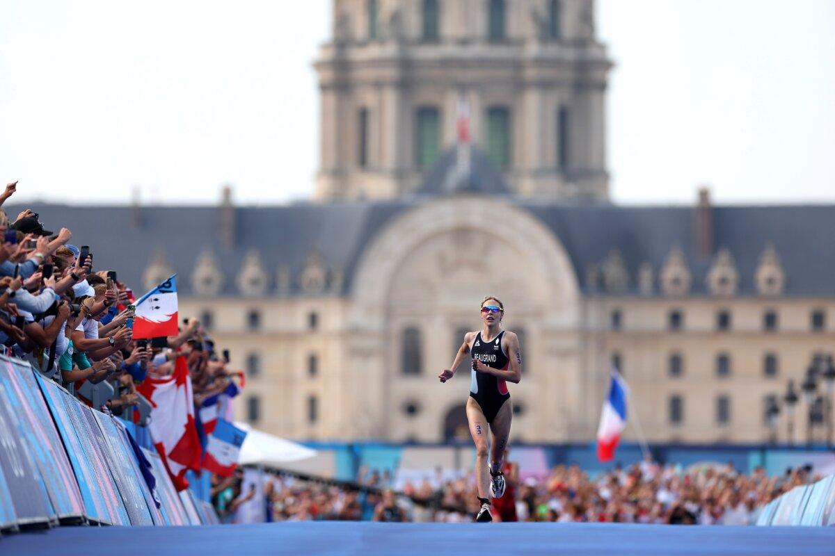 Cassandre Beaugrand of Team France runs to the finish line to win the gold medal in Women's Individual Triathlon on day five of the Olympic Games Paris 2024 at Pont Alexandre III in Paris on July 31, 2024. (Michael Steele/Getty Images)
