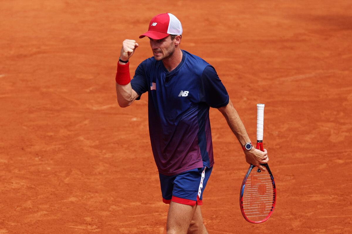 Tommy Paul of Team United States celebrates against Corentin Moutet of Team France during the Men's Singles Third Round match on day five of the Olympic Games Paris 2024 at Roland Garros in Paris on July 31, 2024. (Matthew Stockman/Getty Images)