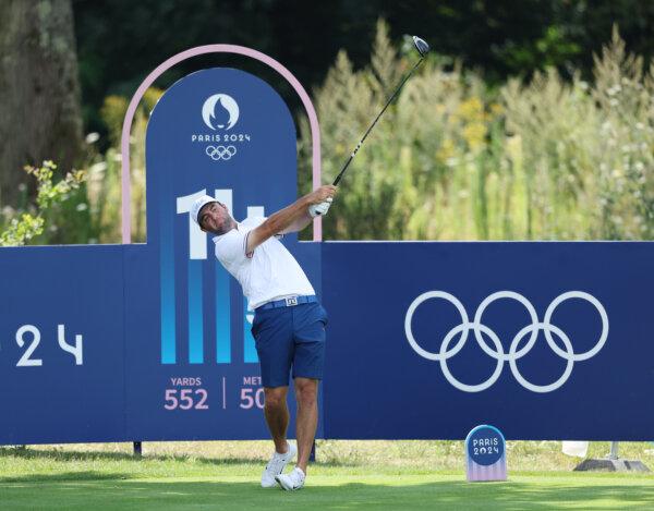 Scottie Scheffler of Team United States tees off on the 14th hole during a practice round on day five of the Olympic Games Paris 2024 at Le Golf National in Paris, France, on July 31, 2024. (Kevin C. Cox/Getty Images)