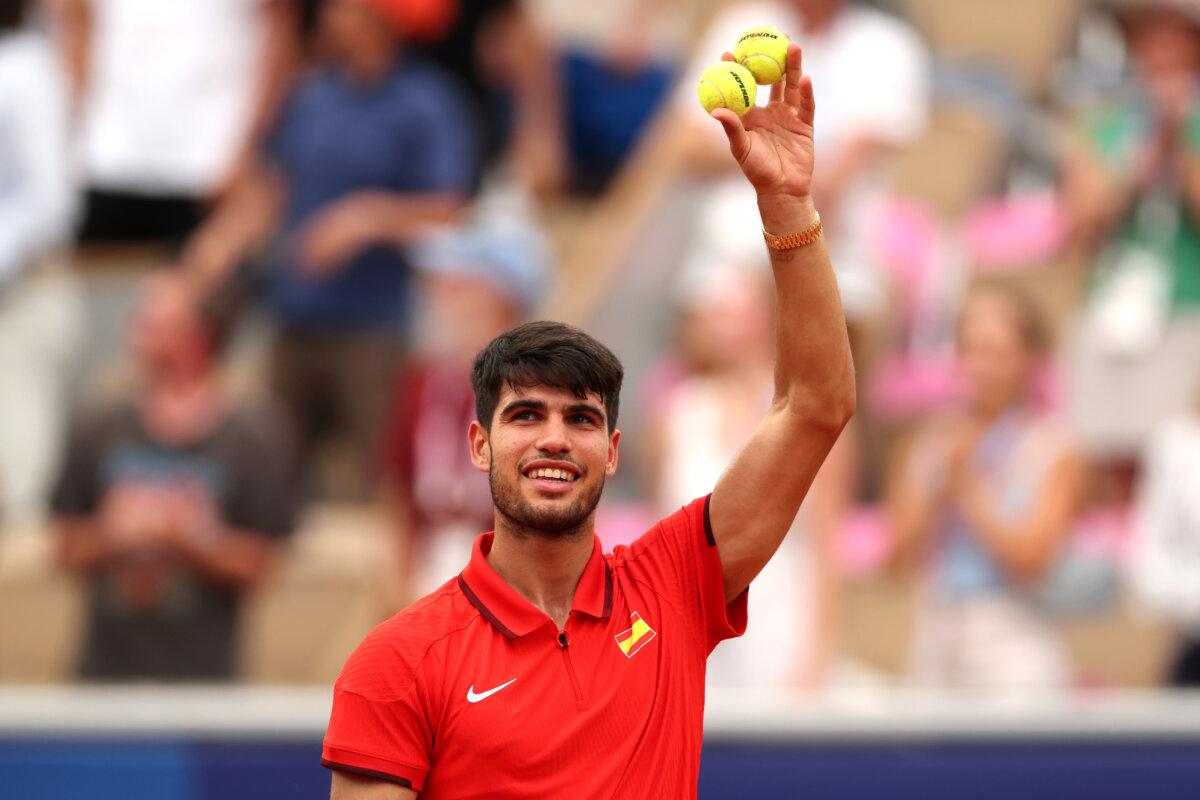 Carlos Alcaraz of Team Spain celebrates after winning match point against Roman Safiullin of Team Individual Neutral Athletes during the Men's Singles Third Round match on day five of the Olympic Games Paris 2024 at Roland Garros, in Paris, on July 31, 2024. (Matthew Stockman/Getty Images)