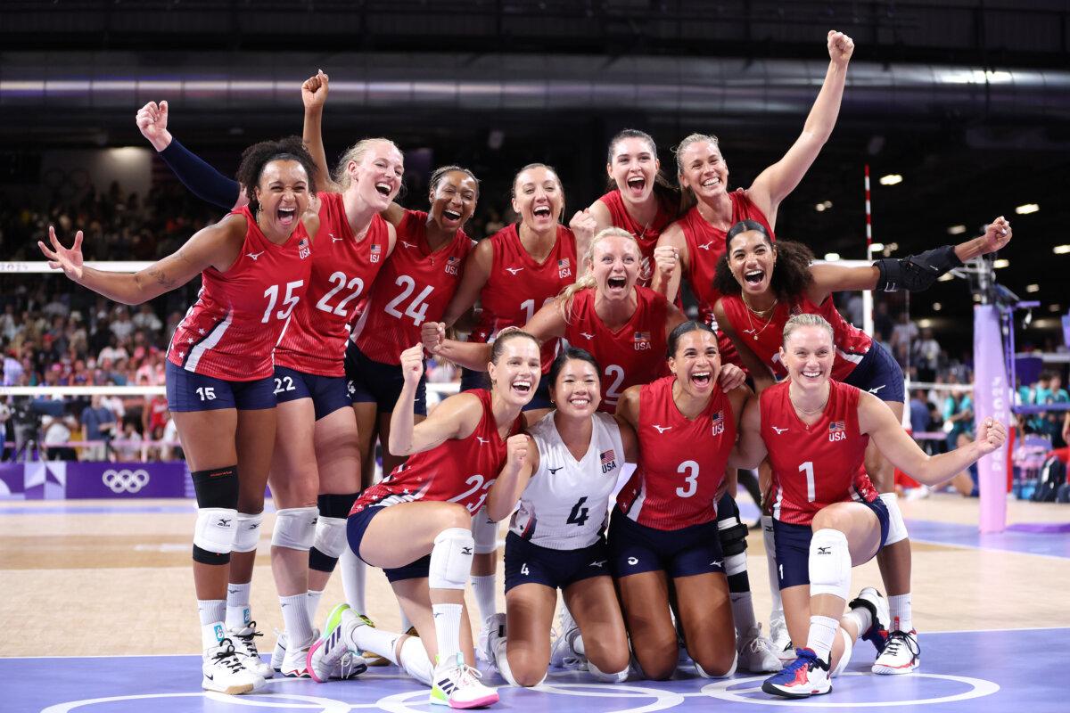 The United States Women's Volleyball team poses for a photo after beating Team Serbia during a Women's Preliminary Round match on day five of the Olympic Games Paris 2024 at Paris Arena in Paris on July 31, 2024. (Clive Brunskill/Getty Images)