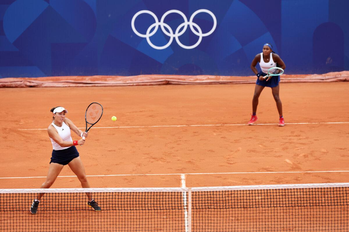 Jessica Pegula of Team United States plays a backhand as partner Coco Gauff of Team United States looks on against Karolina Muchova of Team Czechia and Linda Noskova of Team Czechia during the Women's Doubles Second Round match on day five of the Olympic Games Paris 2024 at Roland Garros in Paris on July 31, 2024. (Matthew Stockman/Getty Images)