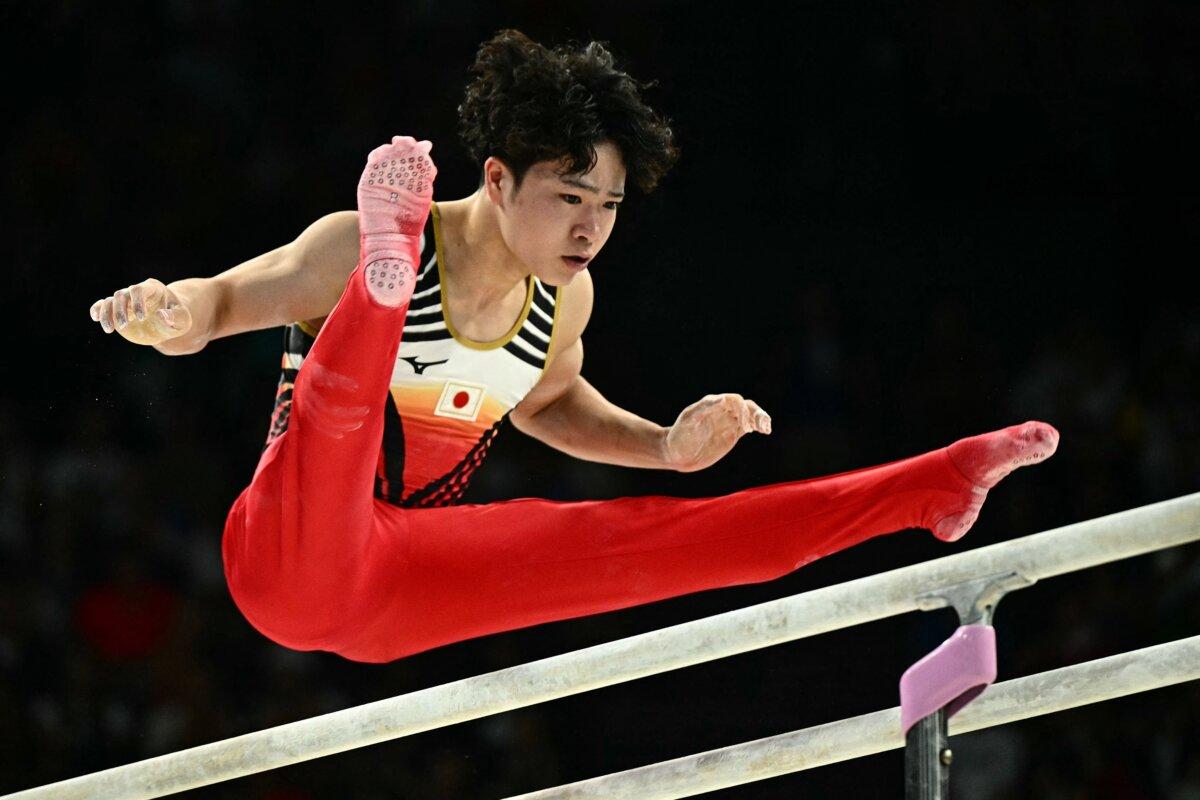 Japan's Shinnosuke Oka competes in the parallel bars event of the artistic gymnastics men's all-around final during the Paris 2024 Olympic Games at the Bercy Arena in Paris, on July 31, 2024. (Gabriel Bouys/ AFP via Getty Images)
