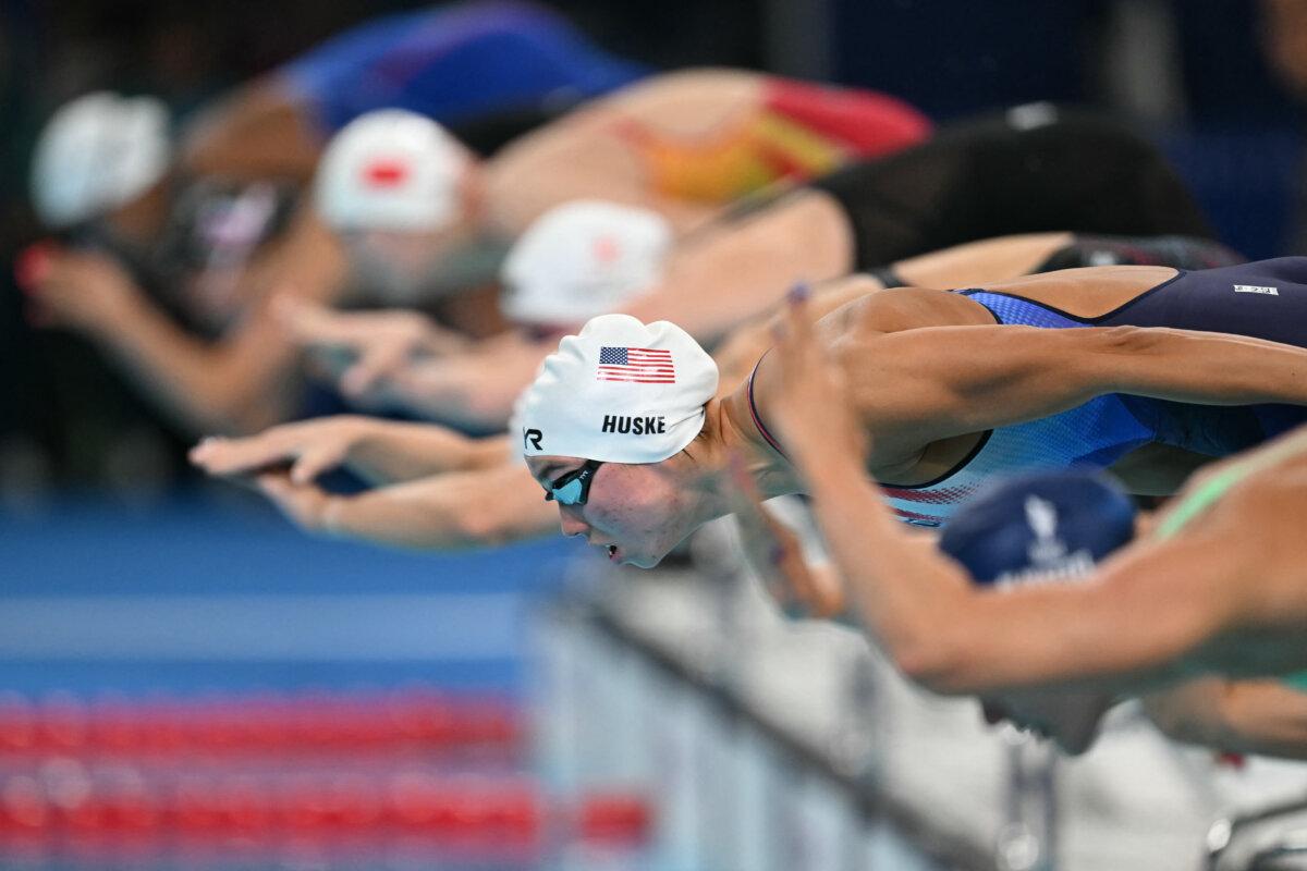 US' Torri Huske (2nd R) competes in a heat of the women's 100m freestyle swimming event during the Paris 2024 Olympic Games at the Paris La Defense Arena in Nanterre, west of Paris, on July 30, 2024. (Jonathan Nackstrand / AFP via Getty Images)