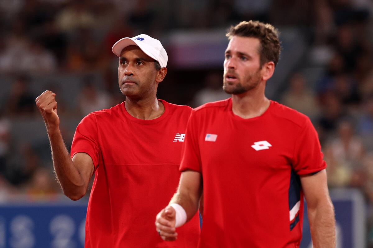 Rajeev Ram of Team United States celebrates with partner Austin Krajicek of Team United States against Carlos Alcaraz of Team Spain and Rafael Nadal of Team Spain during the Men's Doubles Quarter-final match on day five of the Olympic Games Paris 2024 at Roland Garros in Paris on July 31, 2024. (Julian Finney/Getty Images)