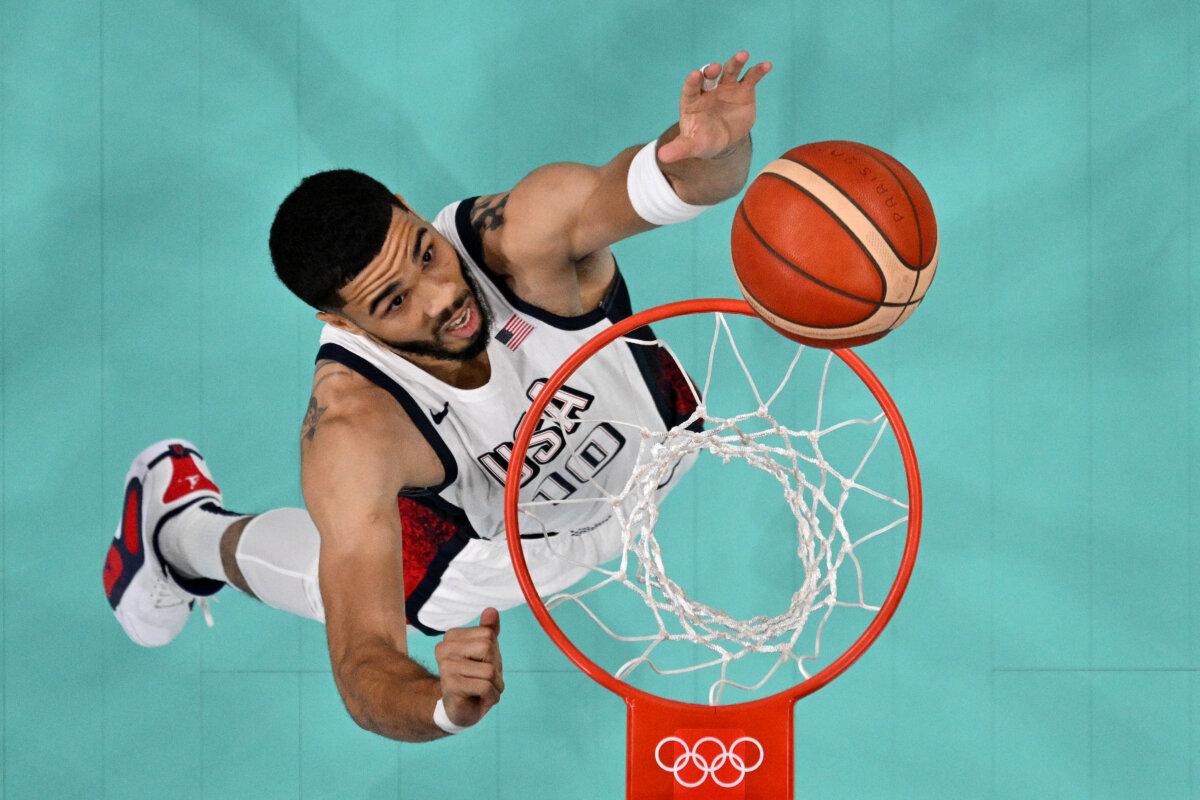 Jayson Tatum #10 of Team United States rebounds during a Men's Group Phase-Group C game between the United States and South Sudan on day five of the Olympic Games Paris 2024 at Stade Pierre Mauroy in Lille, France, on July 31, 2024. (Pool/2024 Getty Images)
