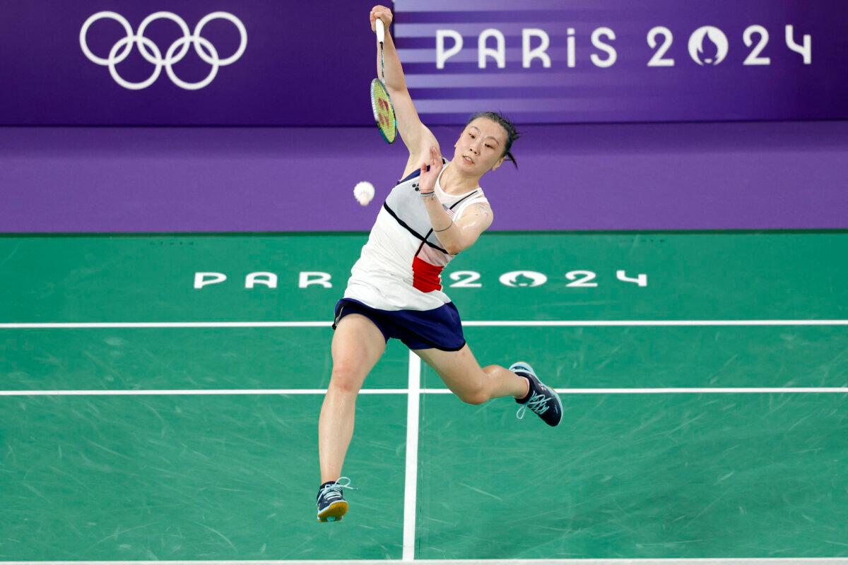 US' Beiwen Zhang plays a shot against Vietnam's Nguyen Thuy Linh in their women's singles badminton group stage match during the Paris 2024 Olympic Games at Porte de la Chapelle Arena in Paris on July 31, 2024. (Luis Tato/AFP via Getty Images)