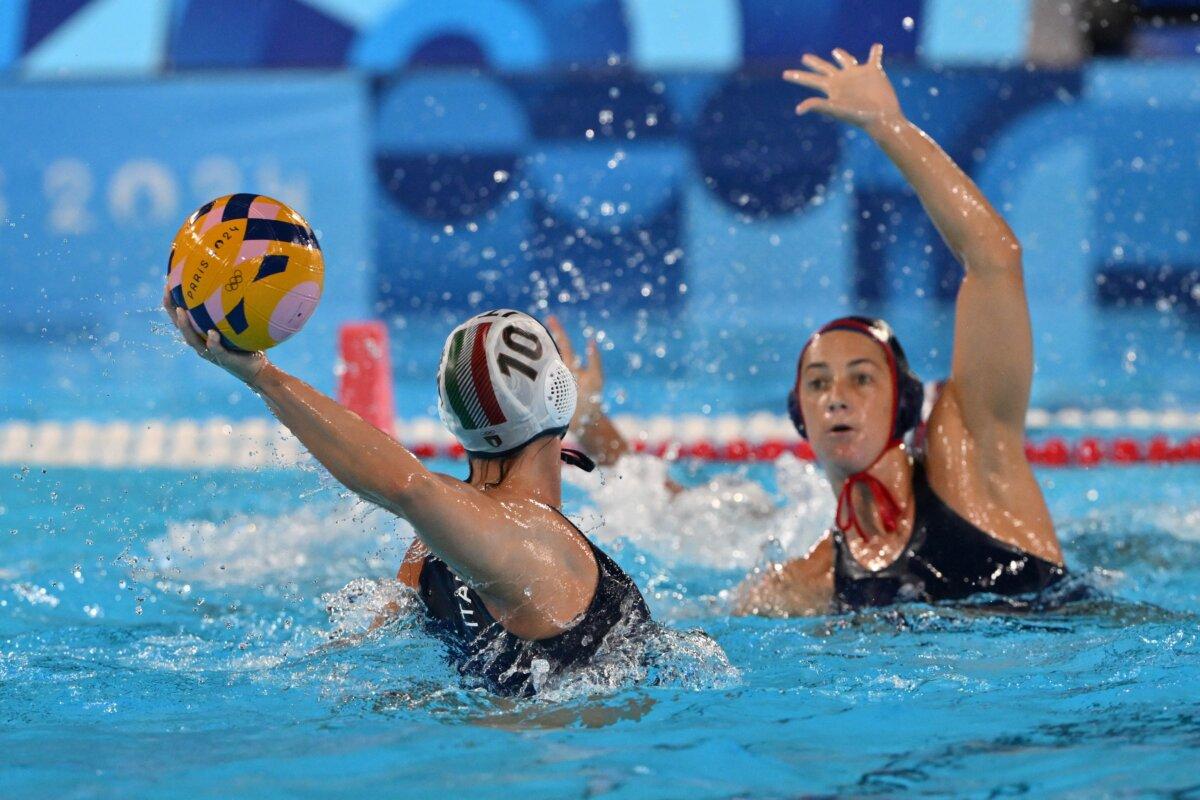 Italy's #10 Claudia Roberta Marletta (L) shoot the ball in the women's water polo preliminary round group B match between Italy and USA during the Paris 2024 Olympic Games at the Aquatics Centre in Saint-Denis, north of Paris, on July 31, 2024. (Andreas Solaro /AFP via Getty Images)