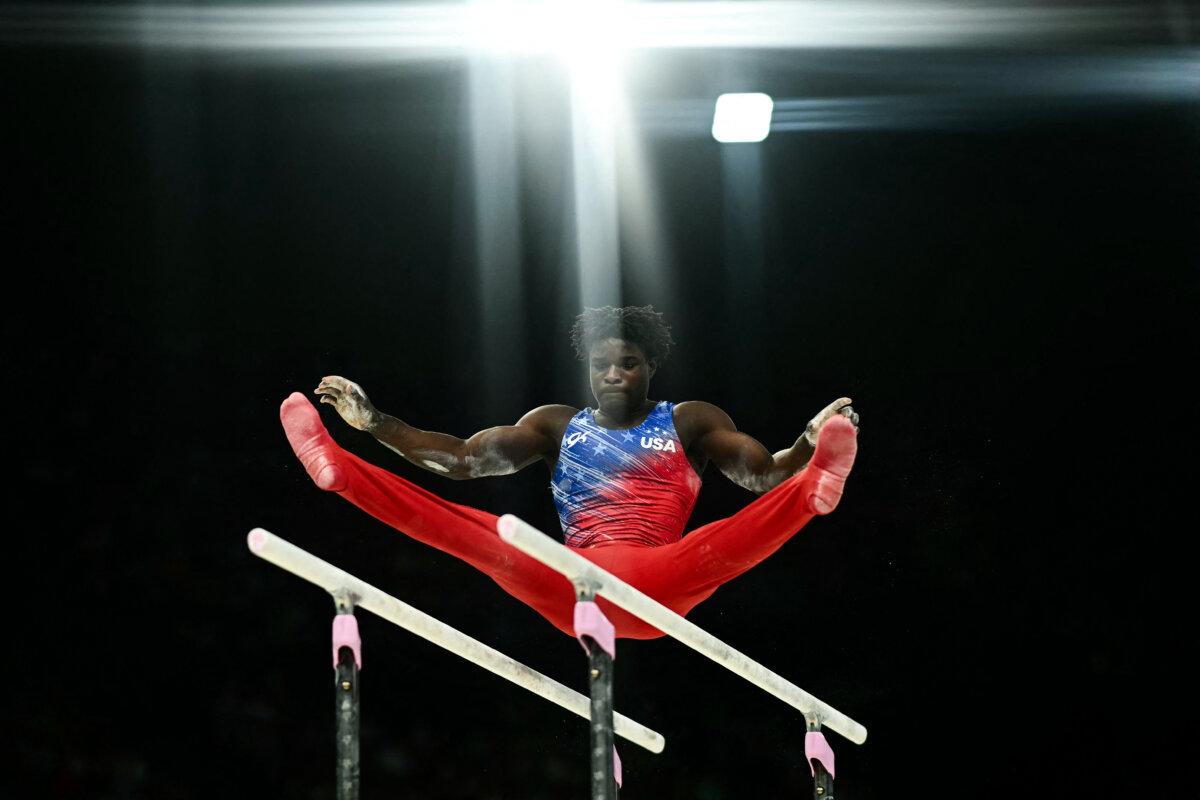 US' Frederick Richard competes in the parallel bars event of the artistic gymnastics men's all-around final during the Paris 2024 Olympic Games at the Bercy Arena in Paris, on July 31, 2024. (Loic Venance/AFP via Getty Images)