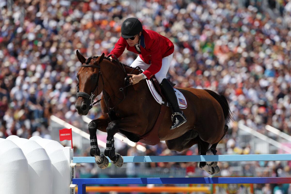 Karl Cook and horse Caracole De La Roque of Team United States compete in the Jumping Team Qualifier on day six of the Olympic Games Paris 2024 at Chateau de Versailles in Versailles, France, on August 01, 2024. (Mike Hewitt/Getty Images)