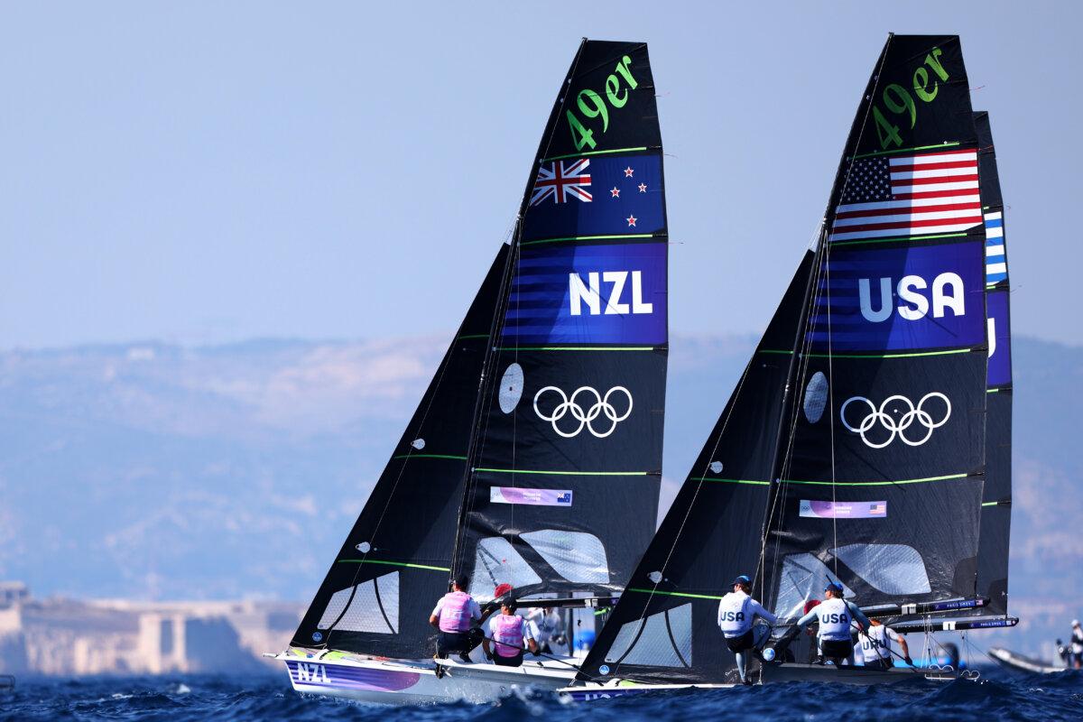 (L-R) Isaac Mchardie and Dominik Mckenzie of Team New Zealand, and Ian Barrows and Hans Henken of Team United States of America compete during the Men's Skiff Men's Skiff 49er class Medal Race on day six of the Olympic Games Paris 2024 at Marseille Marina in Marseille, France on August 1, 2024. (Phil Walter/Getty Images)
